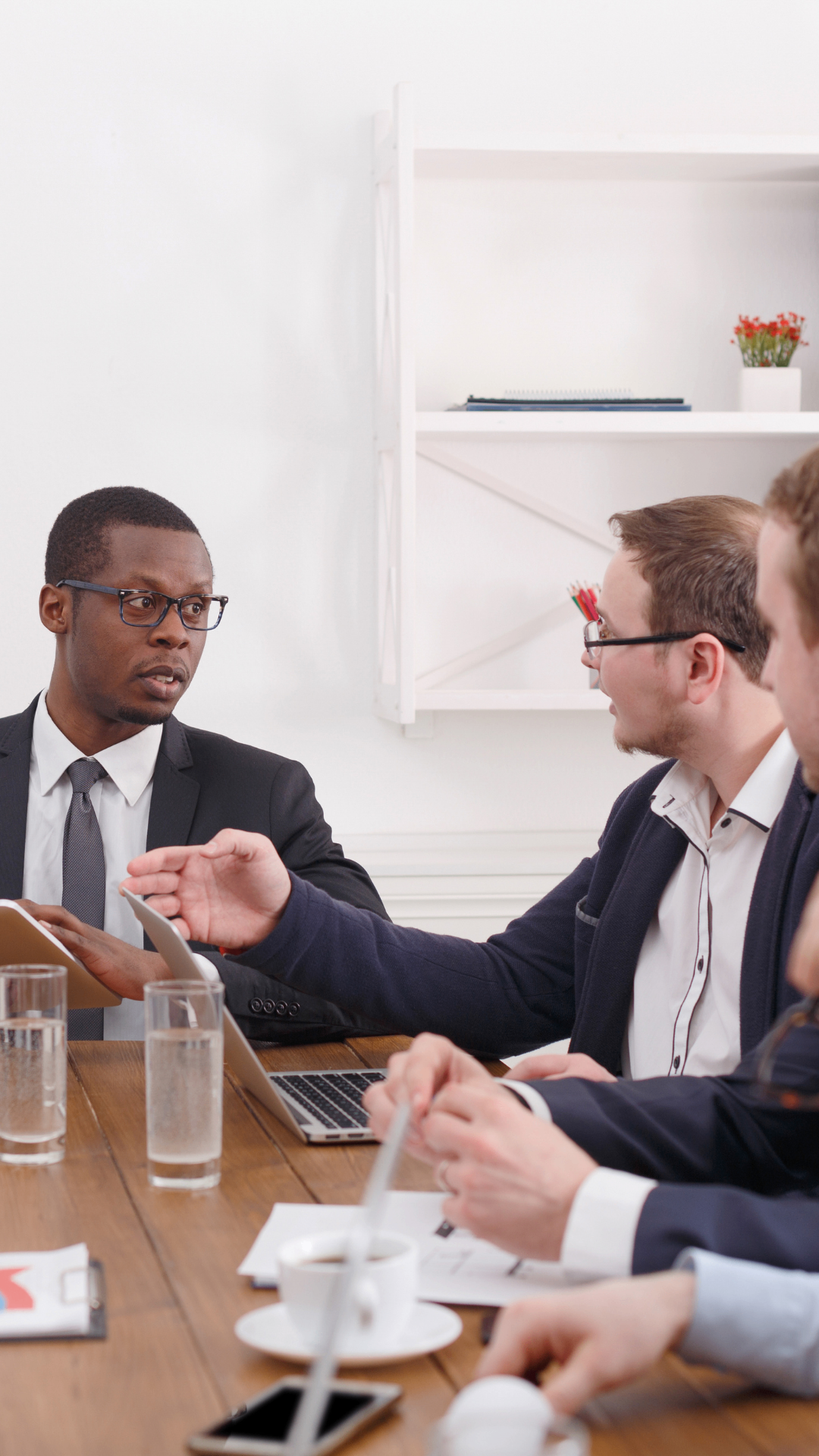 Executive reviewing a leadership dashboard on a tablet